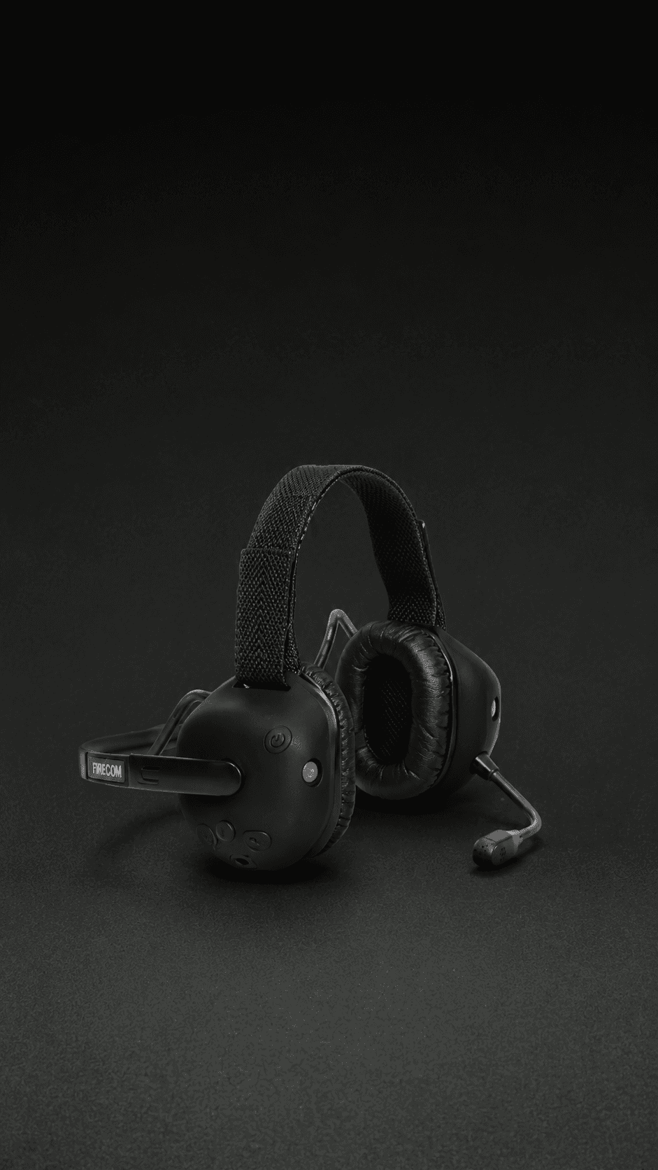 Firecom headset with ear domes and boom microphone ready for apparatus use