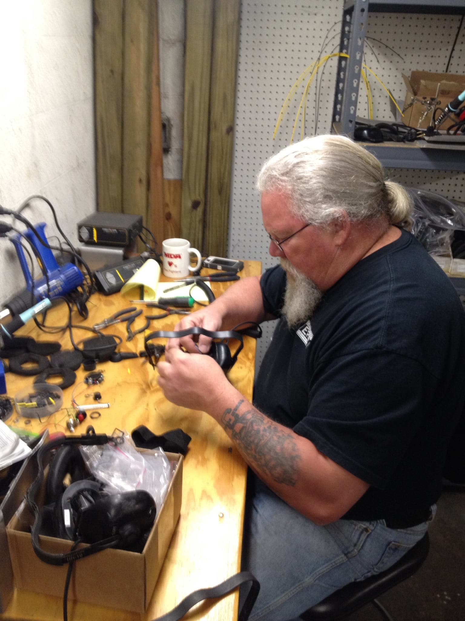 EFES technician repairing a fire-service communication headset