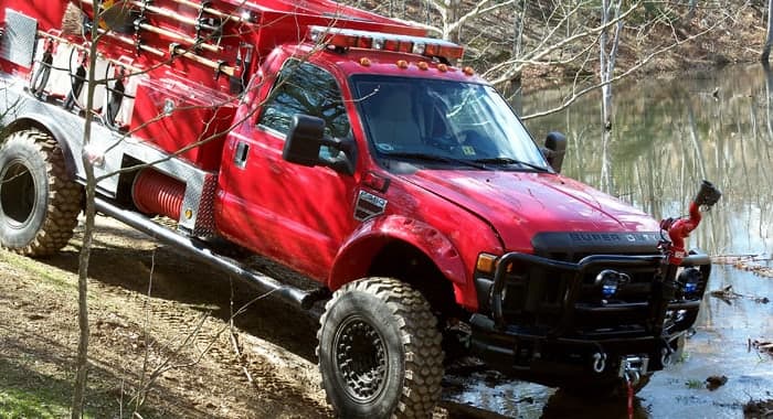 Red brush apparatus working in deep mud, the kind of vehicle a two-position radio interface suits