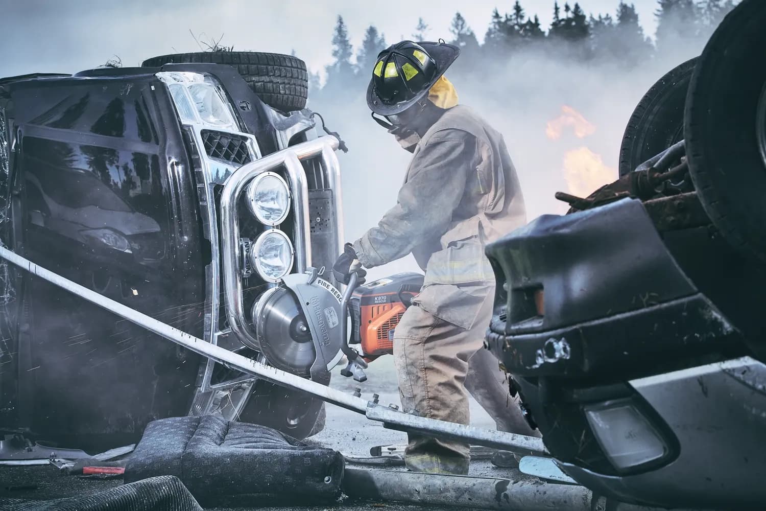 Firefighter operating a Truckman's Choice rescue saw during training